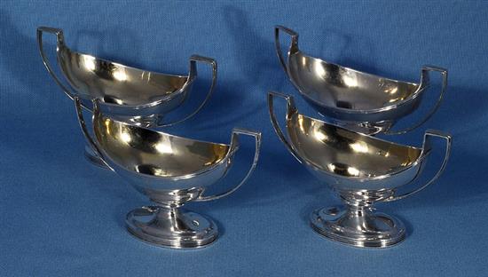 A set of four George III silver salts, by Robert & David Hennell, Length 135mm, weight 12.8oz/400grms.